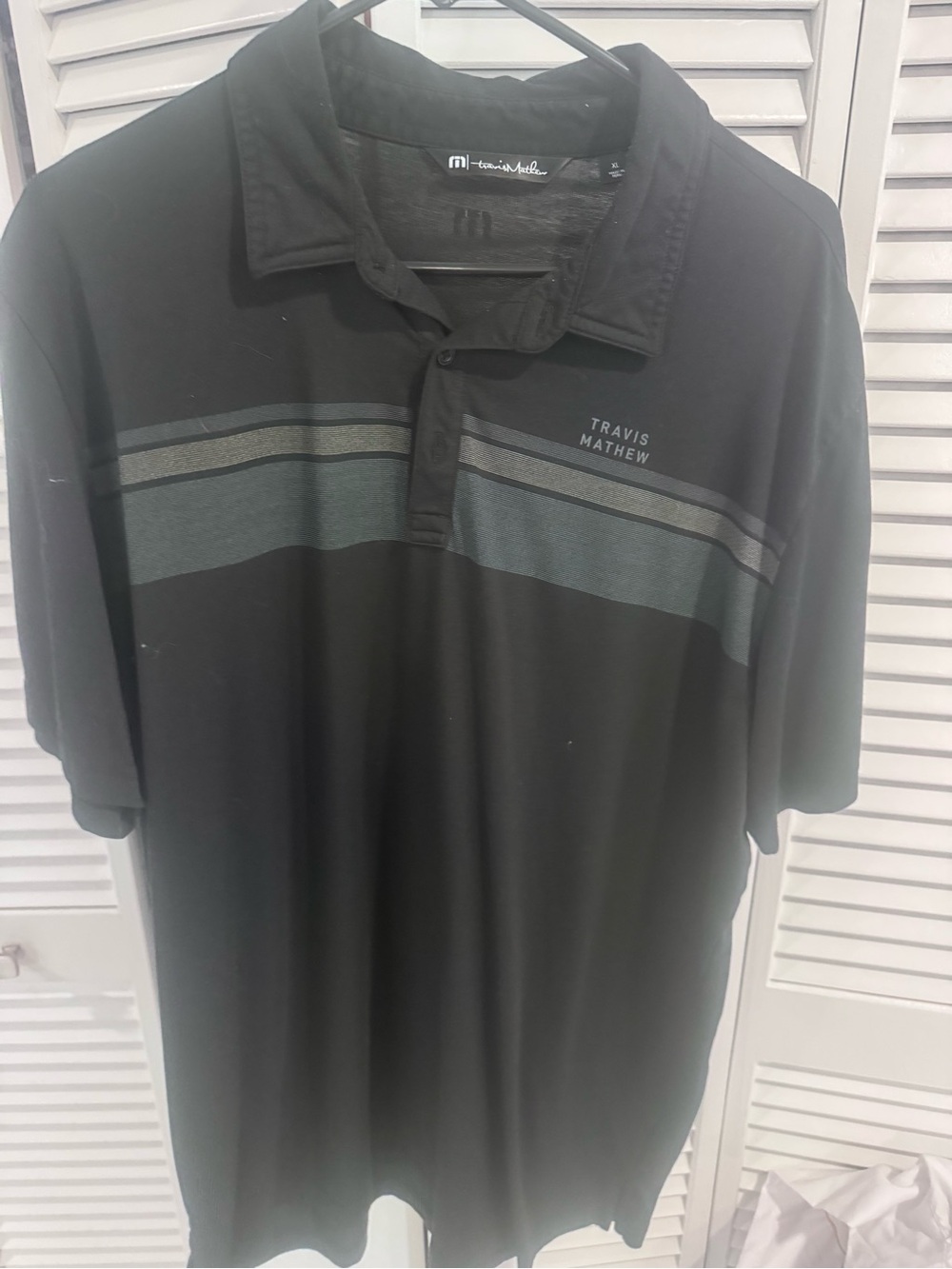 Travis Mathew Black Polo with Gray Stripe Accents